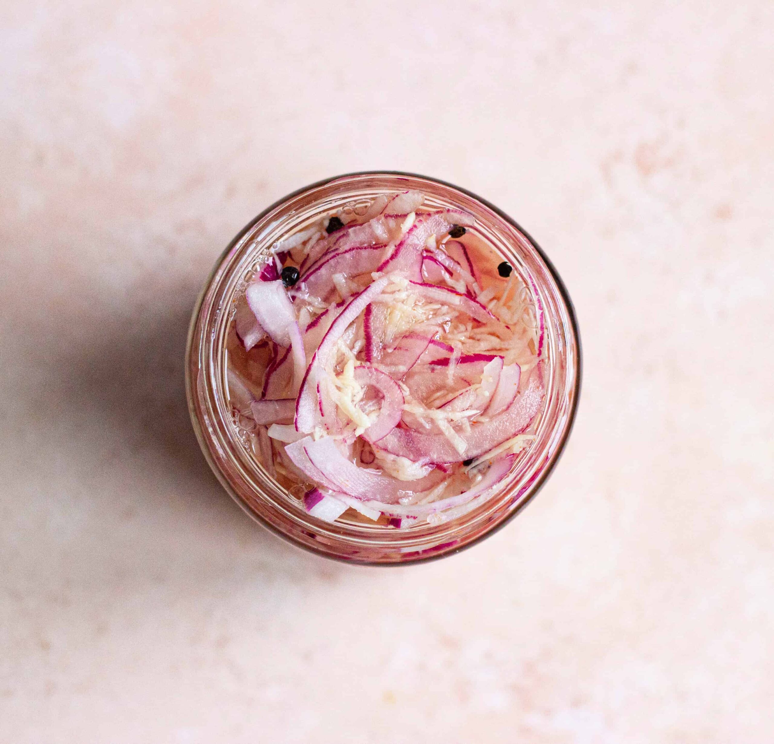 spicy pickled onions in glass jar