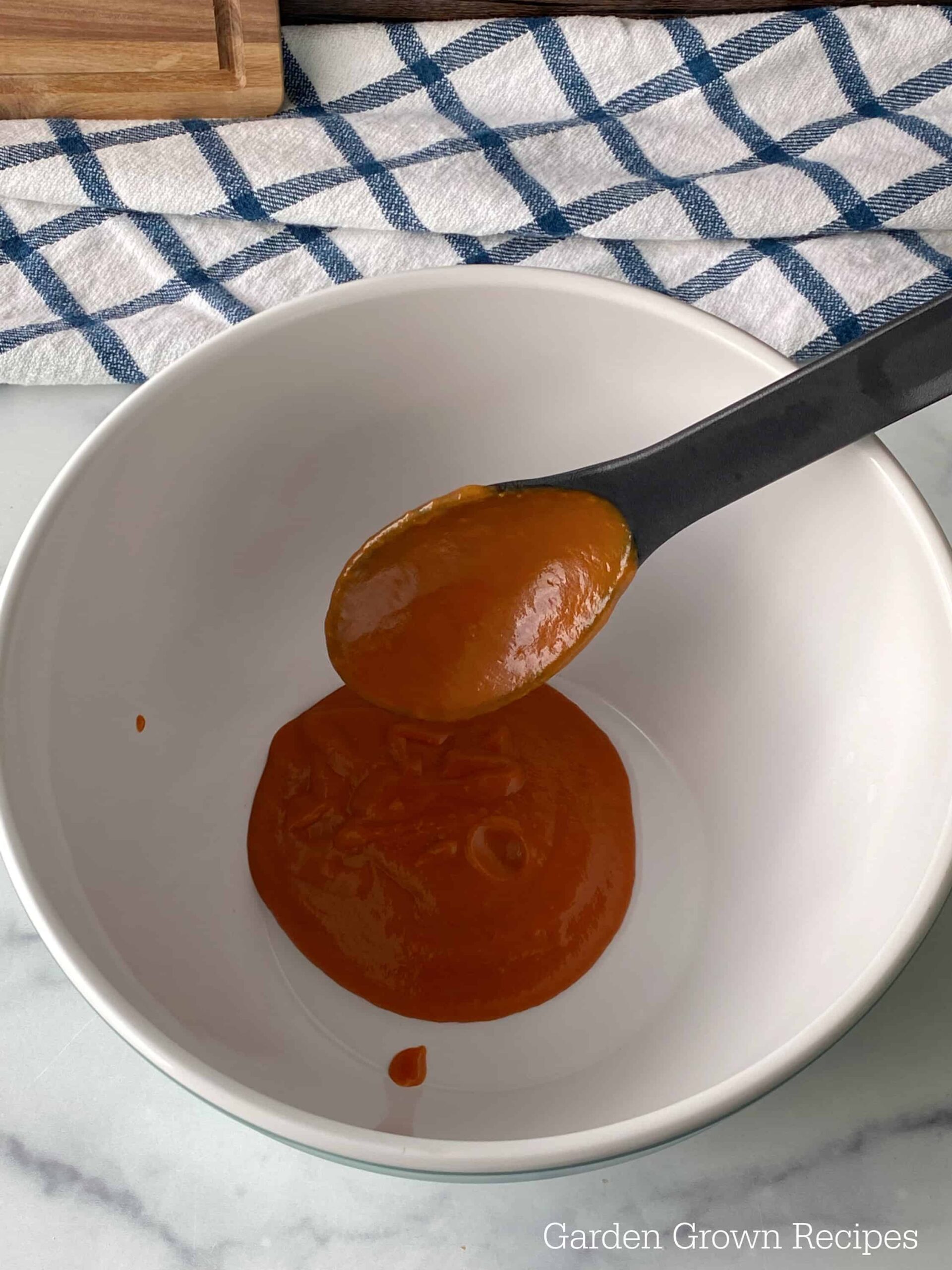 spoon sauce into a bowl