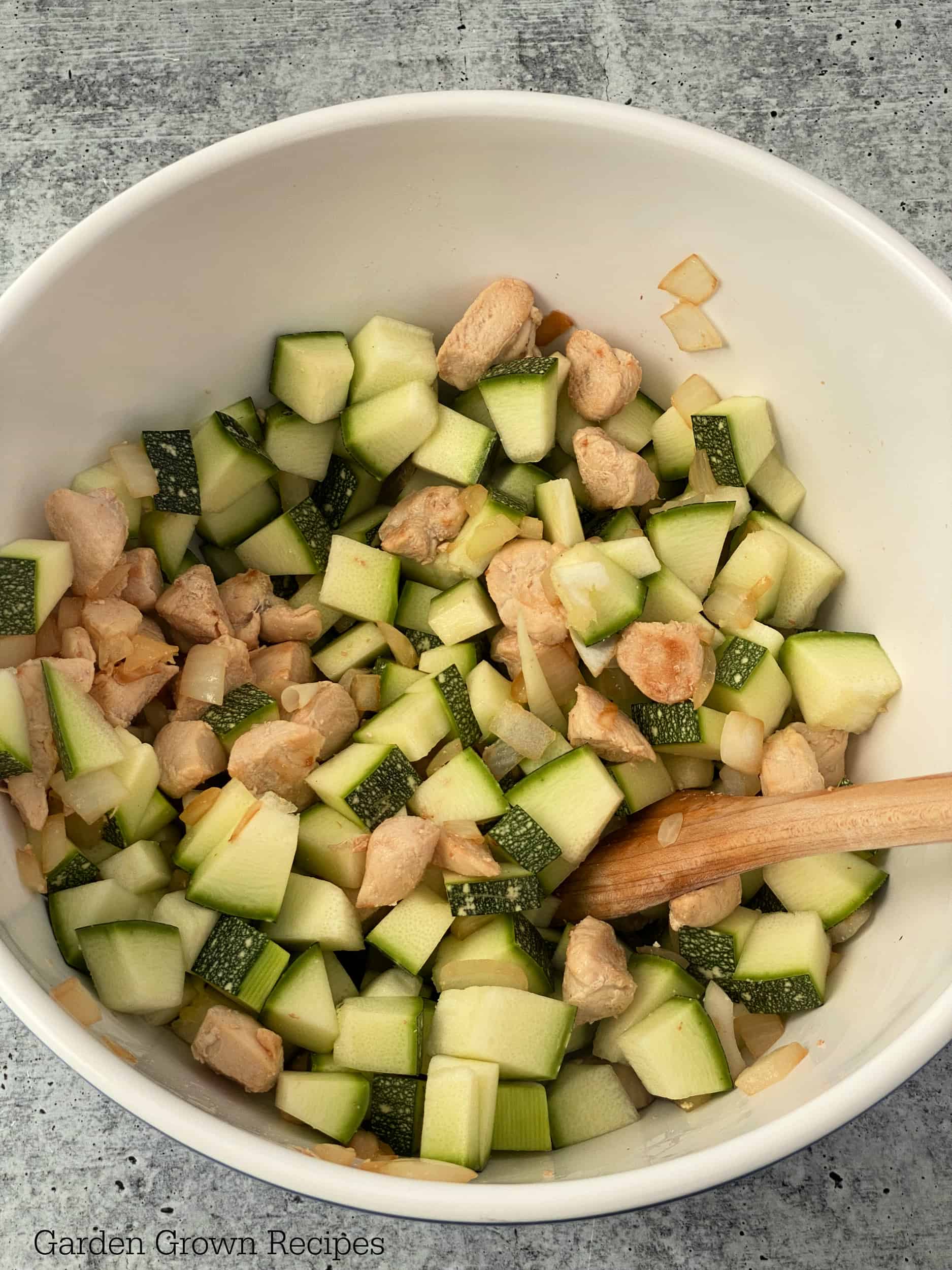 add zucchini to bowl with chicken and onions 