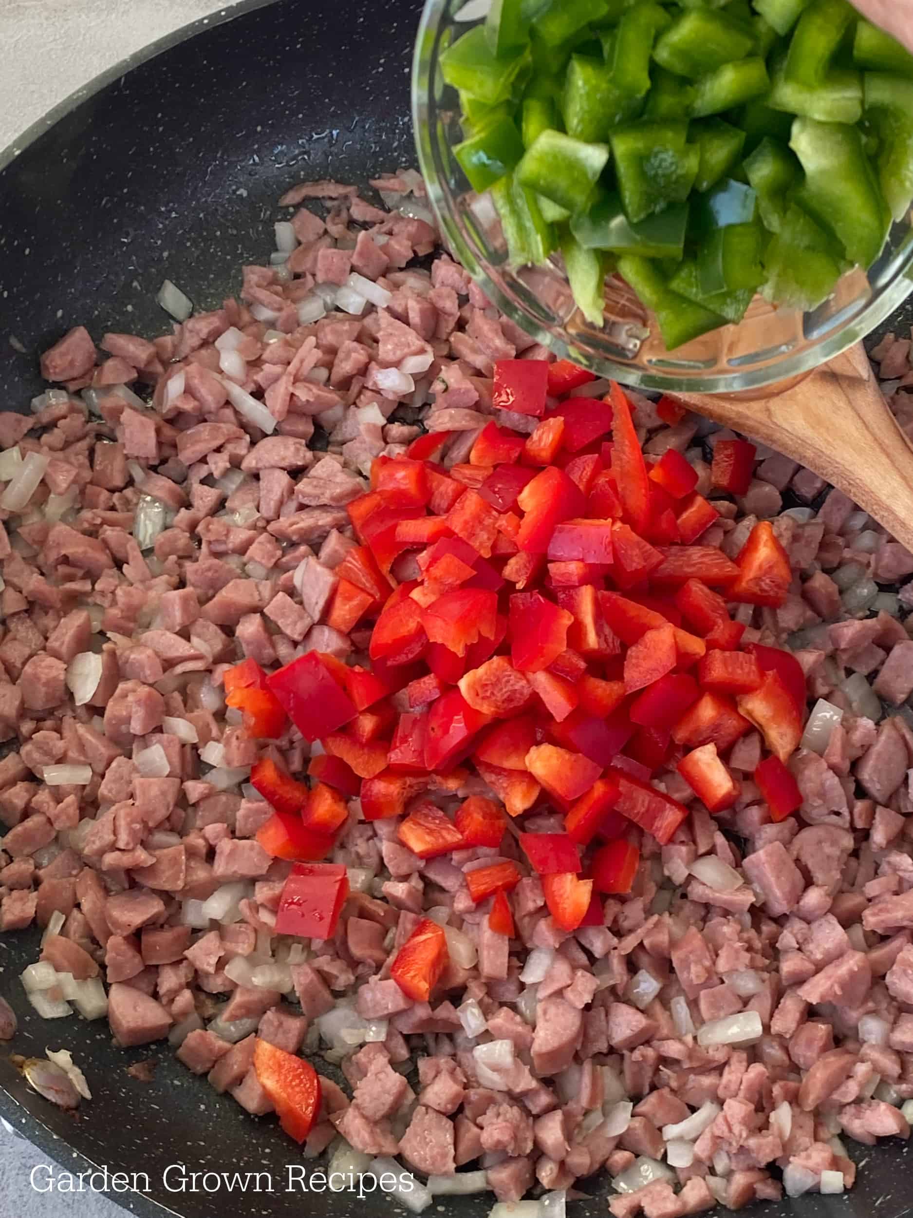 red and green bell peppers in skillet 
